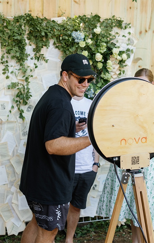 A man smiling while sending a Novabooths photo